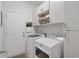 Laundry room with washer, dryer, and ample cabinet storage at 2327 Lark Sparrow St., Myrtle Beach, SC 29577