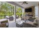Outdoor patio with fireplace, seating area, and a view of the backyard at 2327 Lark Sparrow St., Myrtle Beach, SC 29577