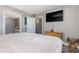 Bedroom with large bed, TV and ensuite bathroom at 2701 S Ocean Blvd. # 1808, North Myrtle Beach, SC 29582