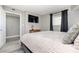 King bedroom with wood-look floors and window at 2701 S Ocean Blvd. # 1808, North Myrtle Beach, SC 29582