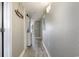 Laundry closet and wood-look floors in hallway at 2701 S Ocean Blvd. # 1808, North Myrtle Beach, SC 29582