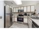 Galley kitchen with stainless steel appliances at 2701 S Ocean Blvd. # 1808, North Myrtle Beach, SC 29582