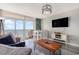 Living room with ocean view, TV, and comfortable seating at 2701 S Ocean Blvd. # 1808, North Myrtle Beach, SC 29582