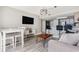 Living area with dining table and open kitchen access at 2701 S Ocean Blvd. # 1808, North Myrtle Beach, SC 29582