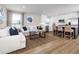 Open concept kitchen with island, stainless steel appliances, and hardwood floors at 2709 Rowyn St., Longs, SC 29568