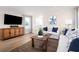 Spacious living room with hardwood floors and neutral color palette at 2709 Rowyn St., Longs, SC 29568