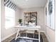 Bright home office features built-in shelving and hardwood floors at 2709 Rowyn St., Longs, SC 29568