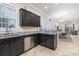 Kitchen with stainless steel appliances and granite countertops, open to dining area at 305 Shuffleboard Ct., Myrtle Beach, SC 29572