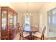 Dining room with wood table, chairs, and china cabinet at 651 Bluebird Ln., Murrells Inlet, SC 29576