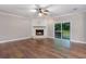 Living room with fireplace, hardwood floors and sliding glass doors at 130 Cooper River Rd., Myrtle Beach, SC 29588