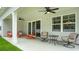 Relaxing covered patio with ceiling fans and comfortable seating at 1841 Brook Park Pl., Conway, SC 29526