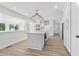 Modern kitchen with white cabinets, center island and hardwood floors at 204 Green Lake Dr., Myrtle Beach, SC 29572