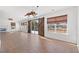 Spacious dining area with tile floors and barn doors leading to the patio at 2053 Haystack Way, Myrtle Beach, SC 29579