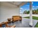 Relaxing backyard patio with wooden bench and side table at 207 Palmetto Sand Loop, Conway, SC 29527