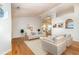 Living room with hardwood floors, staged furniture, and natural light at 210 Forest Dr., Longs, SC 29568