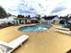 Community pool with lounge chairs at 210 Forest Dr., Longs, SC 29568