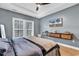 Comfortable bedroom featuring a ceiling fan, wood floors, and a wall-mounted TV at 28 Pinnacle Dr., Murrells Inlet, SC 29576