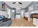 Cozy living room with wood floors, a staircase, and built-in shelving units at 28 Pinnacle Dr., Murrells Inlet, SC 29576