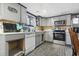 Galley kitchen boasting gray cabinets and stainless steel appliances at 3055 Chestnut St., Loris, SC 29569