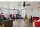 Living room with hardwood floors, two armchairs, and Christmas tree at 3055 Chestnut St., Loris, SC 29569