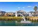 Waterfront home with private dock and surrounding houses at 310 46Th Ave. N, North Myrtle Beach, SC 29582