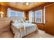 Bedroom with a double bed, dresser, and wood paneled walls at 310 46Th Ave. N, North Myrtle Beach, SC 29582