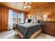 Bright bedroom with wood paneling, two windows, and nautical decor at 310 46Th Ave. N, North Myrtle Beach, SC 29582