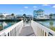 Private dock leading to the waterway with houses on each side at 310 46Th Ave. N, North Myrtle Beach, SC 29582