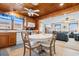 Open kitchen with wood cabinets, round table, and view into living room at 310 46Th Ave. N, North Myrtle Beach, SC 29582