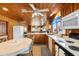 Open kitchen with wood cabinets, island, and adjacent dining area at 310 46Th Ave. N, North Myrtle Beach, SC 29582