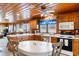 Open kitchen with wood cabinets, island, and adjacent dining area at 310 46Th Ave. N, North Myrtle Beach, SC 29582