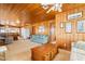 Bright living room with wood paneling, comfortable seating and a coffee table at 310 46Th Ave. N, North Myrtle Beach, SC 29582