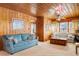 Living room features wood paneled walls, comfy seating and a coffee table at 310 46Th Ave. N, North Myrtle Beach, SC 29582