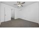 Spacious bedroom with ceiling fan and access to hallway at 310 Lakeside Dr. # C, Surfside Beach, SC 29575