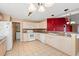 Kitchen with light wood cabinets and red accent wall at 352 Mckendree Ln., Myrtle Beach, SC 29579