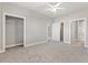 Spacious bedroom with carpet, ceiling fan and multiple closets at 4879 Luster Leaf Circle # 303, Myrtle Beach, SC 29577