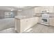 White appliances and light wood cabinets in kitchen at 4879 Luster Leaf Circle # 303, Myrtle Beach, SC 29577