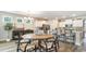 Open dining area with a round wooden table and seating for six at 6040 Forest Dell Ct, Myrtle Beach, SC 29579