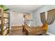 Spacious home office with a large desk and wood flooring, perfect for work or study at 6040 Forest Dell Ct, Myrtle Beach, SC 29579