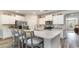 Modern kitchen island with white cabinets and quartz countertops at 6040 Forest Dell Ct, Myrtle Beach, SC 29579