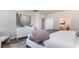 Main bedroom with dresser, ensuite bathroom, and neutral decor at 6040 Forest Dell Ct, Myrtle Beach, SC 29579