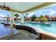 Relaxing pool area with a swim-up bar and outdoor kitchen at 6040 Forest Dell Ct, Myrtle Beach, SC 29579