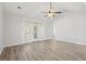 Bright living room featuring hardwood floors and sliding glass doors at 607 Sunnyside Dr. # 201, Murrells Inlet, SC 29576