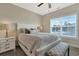 Bright bedroom with a queen-size bed and bench at 628 Lorenzo Dr. # 628, North Myrtle Beach, SC 29582