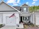 Gray two-story home with white garage door and welcoming front porch at 628 Lorenzo Dr. # 628, North Myrtle Beach, SC 29582