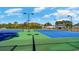 Two tennis courts with green and blue surface at 7019 Shooting Star Way, Myrtle Beach, SC 29579