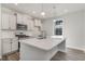 Modern kitchen featuring white cabinets, quartz countertops, and stainless steel appliances at 7035 Shooting Star Way, Myrtle Beach, SC 29579