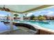 Poolside bar with granite countertop and seating at 7035 Shooting Star Way, Myrtle Beach, SC 29579