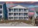 Three-story beach home with multiple balconies and ocean views at 909 S Ocean Blvd. # 301, North Myrtle Beach, SC 29582