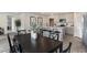 Dining area with a black table and gray kitchen in the background at 93 Ashworth Dr., Tabor City, NC 28463